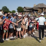 
              Jordan Spieth, right, walks off the golf course after completing the fourth round of the AT&T Byron Nelson golf tournament in McKinney, Texas, on Sunday, May 15, 2022. (AP Photo/Emil Lippe)
            