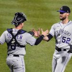 
              Colorado Rockies relief pitcher Daniel Bard (52) celebrates with catcher Brian Serven after the final out of the team's baseball game against the Pittsburgh Pirates in Pittsburgh, Tuesday, May 24, 2022. The Rockies won 2-1 in 10 innings. (AP Photo/Gene J. Puskar)
            