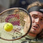 
              Stefanos Tsitsipas returns the ball to Grigor Dimitrov during their match at the Italian Open tennis tournament, in Rome, Wednesday, May 11, 2022. (AP Photo/Andrew Medichini)
            