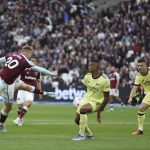 
              West Ham's Jarrod Bowen shoots and scores his sides first goal during the English Premier League soccer match between West Ham United and Arsenal at the London stadium in London, Sunday, May 1, 2022. (AP Photo/Ian Walton)
            