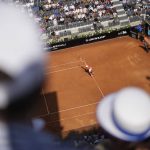 
              Novak Djokovic serves the ball to Aslan Karatsev during their match at the Italian Open tennis tournament, in Rome, Tuesday, May 10, 2022. (AP Photo/Andrew Medichini)
            
