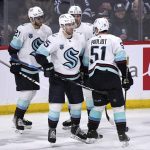 
              Seattle Kraken's Riley Sheahan (15) celebrates his goal against the Winnipeg Jets with Alex Wennberg (21), Joonas Donskoi (72) and Derrick Pouliout (51) during the second period of NHL hockey game action in Winnipeg, Manitoba, Sunday, May 1, 2022. (Fred Greenslade/The Canadian Press via AP)
            