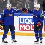 
              Nate Schmidt,  of the United States of America, left, congratulates teammate Sean Farrellcafter he scored the team's fourth goal, during the group B Hockey World Championship match between Norway and The United States, in Tampere, Finland, Tuesday, May 24, 2022. (Vesa Moilanen/Lehtikuva via AP)
            