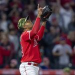 
              Los Angeles Angels relief pitcher Raisel Iglesias points to the sky, after the Angels defeated the Oakland Athletics 5-3 in a baseball game in Anaheim, Calif., Saturday, May 21, 2022. (AP Photo/Alex Gallardo)
            