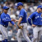 
              Toronto Blue Jays starting pitcher Jose Berrios (17) is relieved manager Charlie Montoyo, center left, in the sixth inning of a baseball game, Wednesday, May 11, 2022, in New York. (AP Photo/John Minchillo)
            