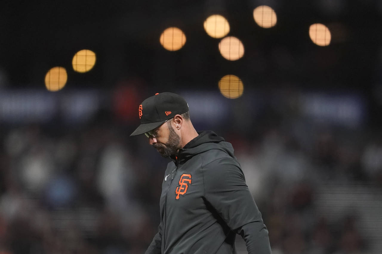 San Francisco Giants manager Gabe Kapler walks to the dugout after making a pitching change during ...