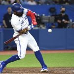 
              Toronto Blue Jays' Teoscar Hernandez (37) hits a two-run double against the Chicago White Sox during the fifth inning of a baseball game Tuesday, May 31, 2022, in Toronto. (Jon Blacker/The Canadian Press via AP)
            