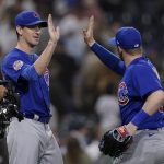 
              Chicago Cubs starting pitcher Kyle Hendricks, left, celebrates with left fielder Ian Happ after the Cubs defeated the San Diego Padres 6-0 in a baseball game Monday, May 9, 2022, in San Diego. (AP Photo/Gregory Bull)
            