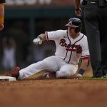 
              Atlanta Braves' Austin Riley (27) slides into second after hitting a double in the eighth inning of a baseball game against the San Diego Padres, Saturday, May 14, 2022, in Atlanta. (AP Photo/Brynn Anderson)
            
