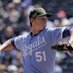
              Kansas City Royals starting pitcher Brady Singer throws during the first inning of a baseball game against the Minnesota Twins Sunday, May 22, 2022, in Kansas City, Mo. (AP Photo/Charlie Riedel)
            