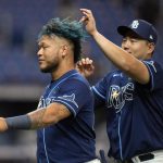 
              Tampa Bay Rays' Ji-Man Choi, right, touches Harold Ramirez's hair after the Rays defeated the Miami Marlins during a baseball game Wednesday, May 25, 2022, in St. Petersburg, Fla. (AP Photo/Chris O'Meara)
            