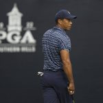 
              Tiger Woods lines up a putt on the 12th hole during the first round of the PGA Championship golf tournament, Thursday, May 19, 2022, in Tulsa, Okla. (AP Photo/Eric Gay)
            