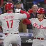 
              Philadelphia Phillies' Rhys Hoskins (17) is greened by Bryson Stott, right, after hitting a solo home run during the second inning of a baseball game against the Seattle Mariners, Monday, May 9, 2022, in Seattle. (AP Photo/Ted S. Warren)
            