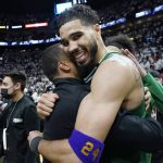 
              Boston Celtics forward Jayson Tatum (0) celebrates after winning Game 7 of the NBA basketball Eastern Conference finals playoff series against the Miami Heat, Sunday, May 29, 2022, in Miami. (AP Photo/Lynne Sladky)
            