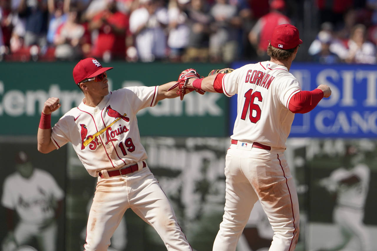 St. Louis Cardinals' Nolan Gorman (16) and Tommy Edman (19) celebrate an 8-3 victory over the Milwa...
