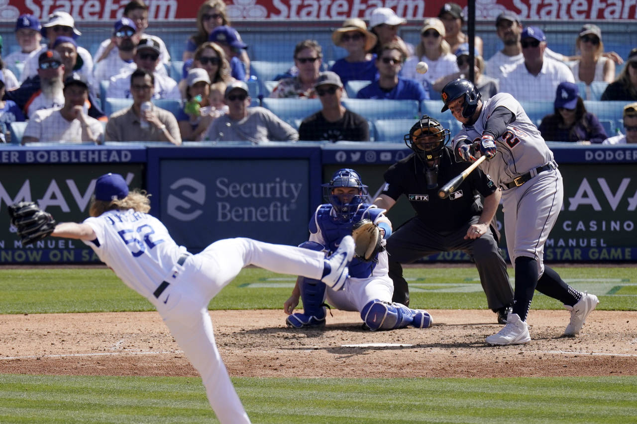 Detroit Tigers' Miguel Cabrera, right, hits a two-run home run as Los Angeles Dodgers relief pitche...