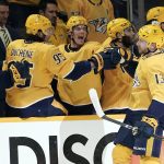
              Nashville Predators' Yakov Trenin (13) is congratulated after scoring a goal against the Colorado Avalanche during the first period in Game 4 of an NHL hockey first-round playoff series Monday, May 9, 2022, in Nashville, Tenn. (AP Photo/Mark Humphrey)
            