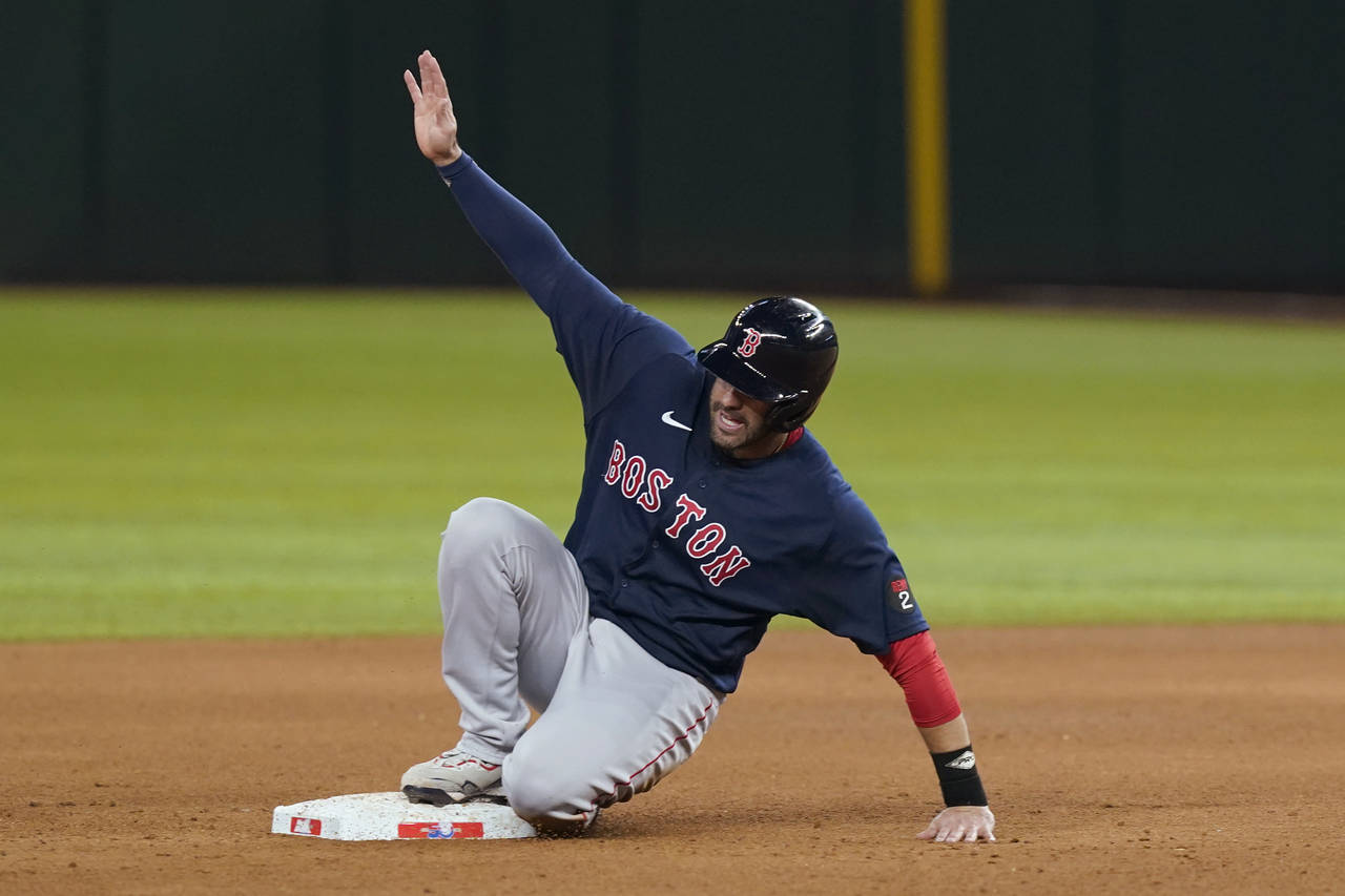 Boston Red Sox's J.D. Martinez reaches second base on a single by Xander Bogaerts during the sixth ...