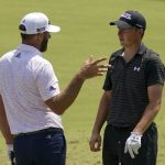 
              Dustin Johnson and Jordan Spieth talk on the driving range before a practice round for the PGA Championship golf tournament, Wednesday, May 18, 2022, in Tulsa, Okla. (AP Photo/Sue Ogrocki)
            