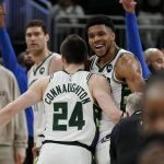 
              Milwaukee Bucks' Pat Connaughton and Giannis Antetokounmpo celebrate after Game 3 of an NBA basketball Eastern Conference semifinals playoff series against the Boston Celtics on Saturday, May 7, 2022, in Milwaukee. The Bucks won 103-101 to take a 2-1 lead in the series. (AP Photo/Morry Gash)
            