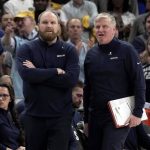 
              Memphis Grizzlies' Head Coach Taylor Jenkins, left, watches his players in the first half of Game 5 of an NBA basketball second-round playoff series against the Golden State Warriors Wednesday, May 11, 2022, in Memphis, Tenn. (AP Photo/Karen Pulfer Focht)
            