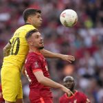 
              Chelsea's Christian Pulisic, front left, jumps for the ball with Liverpool's Jordan Henderson during the English FA Cup final soccer match between Chelsea and Liverpool, at Wembley stadium, in London, Saturday, May 14, 2022. (AP Photo/Kirsty Wigglesworth)
            
