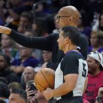 
              Phoenix Suns head coach Monty Williams, rear, talks with an official during the first half of Game 1 in the second round of the NBA Western Conference playoff series Monday, May 2, 2022, in Phoenix. (AP Photo/Matt York)
            