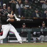 
              Chicago White Sox's Jake Burger hits a three-run home run off Boston Red Sox starting pitcher Rich Hill during the fifth inning of a baseball game Wednesday, May 25, 2022, in Chicago. (AP Photo/Charles Rex Arbogast)
            