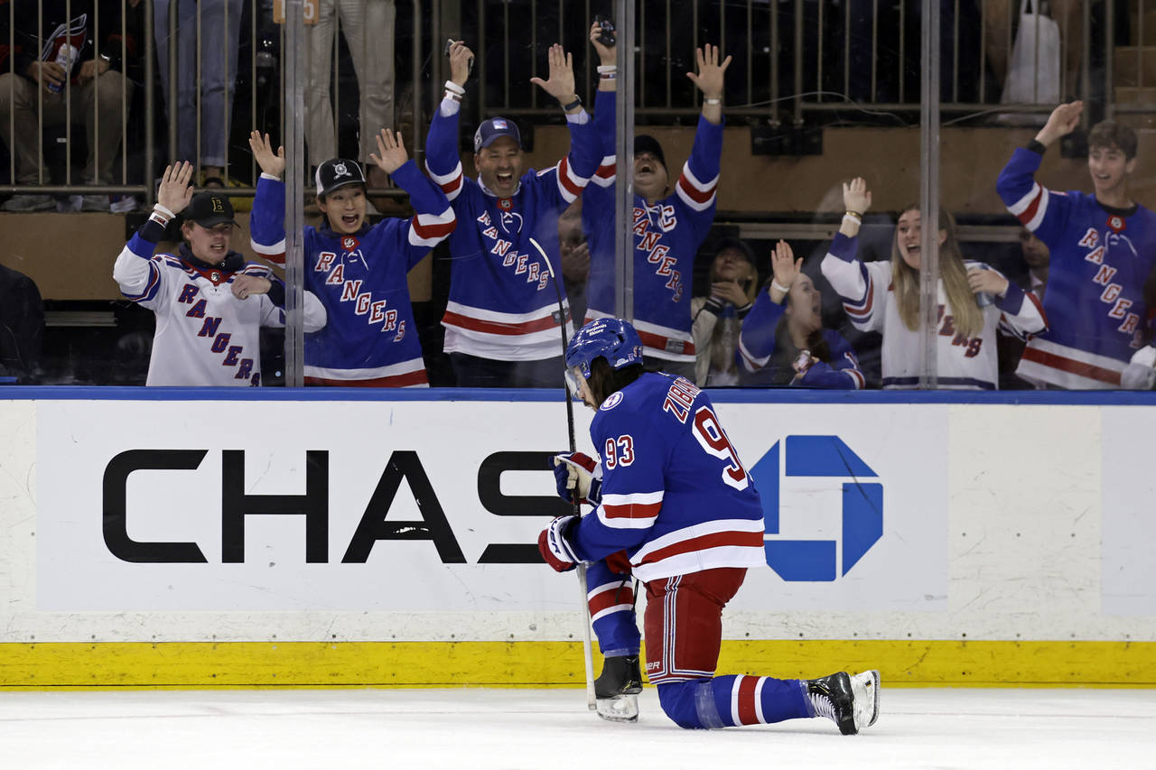 New York Rangers' Mika Zibanejad reacts after scoring a goal against the Carolina Hurricanes in the...