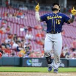 
              Milwaukee Brewers' Omar Narvaez points to the sky as he crosses home plate after hitting a solo home run during the fifth inning of a baseball game against the Cincinnati Reds in Cincinnati, Monday, May 9, 2022. (AP Photo/Aaron Doster)
            