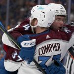 
              Colorado Avalanche's J.T. Compher (37) is congratulated by Bowen Byram (4) after scoring during the third period in Game 6 of an NHL hockey Stanley Cup second-round playoff series against the St. Louis Blues Friday, May 27, 2022, in St. Louis. (AP Photo/Jeff Roberson)
            