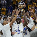 
              Golden State Warriors celebrate with the conference trophy after defeating the Dallas Mavericks in Game 5 of the NBA basketball playoffs Western Conference finals in San Francisco, Thursday, May 26, 2022. (AP Photo/Jeff Chiu)
            