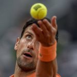 
              Serbia's Novak Djokovic servers against Gael Monfils, of France, during their match at the Mutua Madrid Open tennis tournament in Madrid, Spain, Tuesday, May 3, 2022. (AP Photo/Manu Fernandez)
            