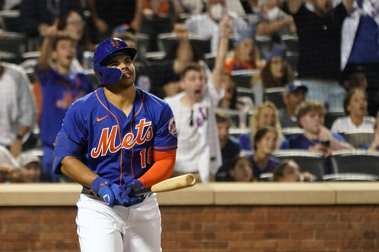 New York Mets' Nick Plummer watches the ball after hitting the game-tying home run for his first ma...