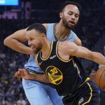 
              Golden State Warriors guard Stephen Curry (30) drives to the basket against Memphis Grizzlies forward Kyle Anderson during the first half of Game 3 of an NBA basketball Western Conference playoff semifinal in San Francisco, Saturday, May 7, 2022. (AP Photo/Jeff Chiu)
            