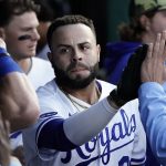 
              Kansas City Royals' Emmanuel Rivera celebrates in the dugout after hitting a solo home run during the seventh inning of a baseball game against the Minnesota Twins Saturday, May 21, 2022, in Kansas City, Mo. (AP Photo/Charlie Riedel)
            