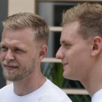 
              Haas driver Kevin Magnussen, left, of Denmark, stands with Haas driver Mick Schumacher, of Germany, during an interview ahead of the Formula One Miami Grand Prix auto race at Miami International Autodrome, Thursday, May 5, 2022, in Miami Gardens, Fla. (AP Photo/Darron Cummings)
            