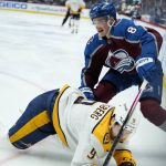 
              Colorado Avalanche defenseman Cale Makar (8) tangles with Nashville Predators left wing Filip Forsberg (9) during the first period in Game 2 of an NHL hockey Stanley Cup first-round playoff series Thursday, May 5, 2022, in Denver. (AP Photo/Jack Dempsey)
            