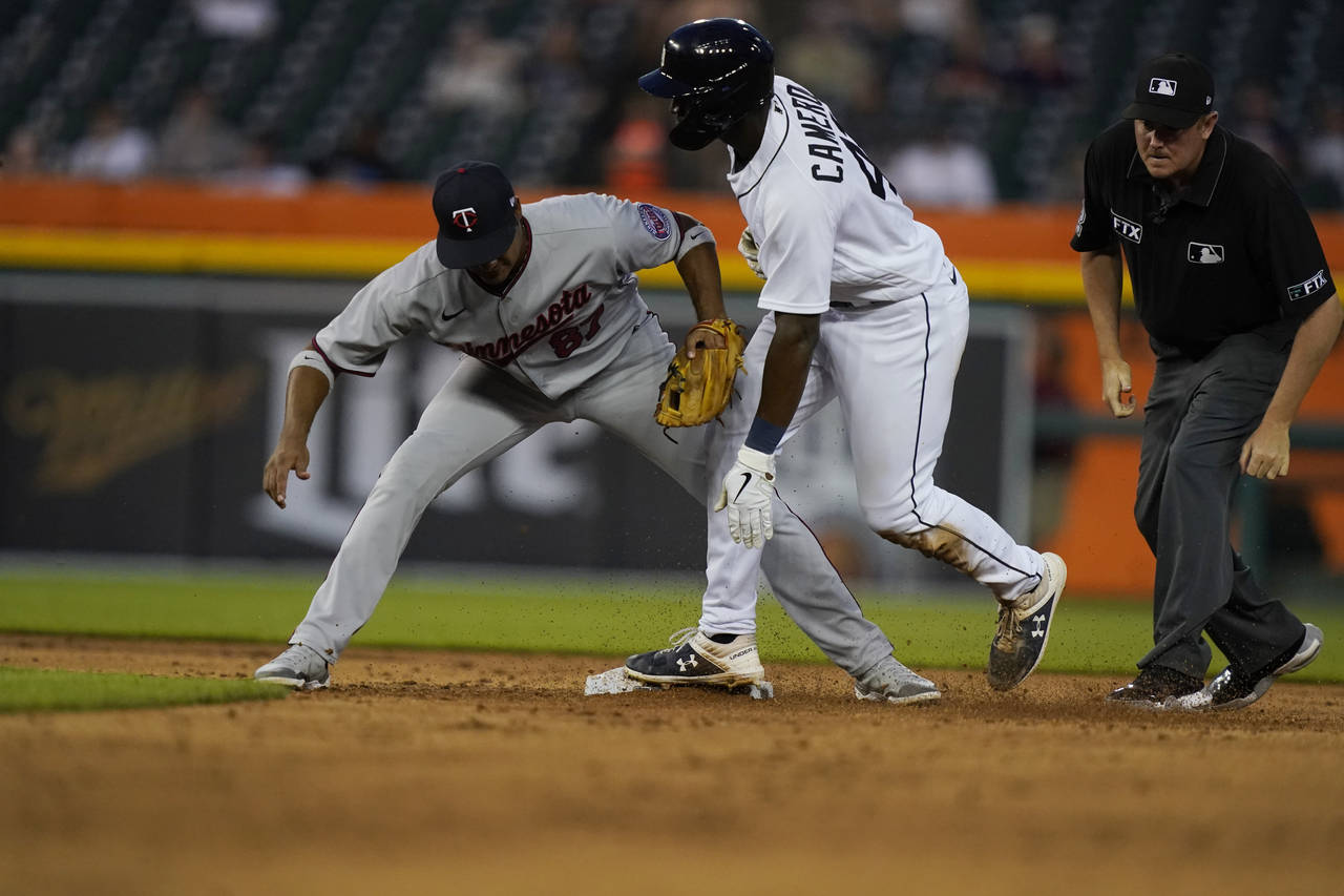 Detroit Tigers' Daz Cameron beats the tag of Minnesota Twins shortstop Jermaine Palacios to steal s...