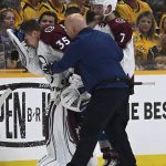 
              Colorado Avalanche goaltender Darcy Kuemper (35) is helped off the ice after getting injured during the first period in Game 3 of an NHL hockey Stanley Cup first-round playoff series against the Nashville Predators Saturday, May 7, 2022, in Nashville, Tenn. (AP Photo/Mark Zaleski)
            