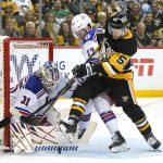 
              Pittsburgh Penguins' Jake Guentzel (59) cannot get his stick on a rebound with New York Rangers' Alexis Lafrenière (13) defending in front of Rangers goalie Igor Shesterkin (31) during the second period in Game 4 of an NHL hockey Stanley Cup first-round playoff series in Pittsburgh, Monday, May 9, 2022. (AP Photo/Gene J. Puskar)
            