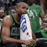 
              Boston Celtics center Al Horford wipes his face while seated on the bench as the Celtics trail the Milwaukee Bucks in the second half of Game 1 in the second round of the NBA Eastern Conference playoff series, Sunday, May 1, 2022, in Boston. (AP Photo/Steven Senne)
            