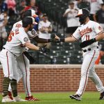 
              Baltimore Orioles' Chris Owings (11) is greeted by Ryan McKenna, left, and Jorge Mateo after scoring a run on a hit by Austin Hays against Tampa Bay Rays starting pitcher Ryan Thompson during the ninth inning of a baseball game, Sunday, May 22, 2022, in Baltimore. (AP Photo/Terrance Williams)
            