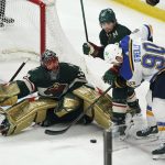 
              St. Louis Blues' Ryan O'Reilly (90) works against Minnesota Wild's Kevin Fiala (22) for the puck in front of Wild goalie Marc-Andre Fleury during the third period of Game 2 of an NHL hockey Stanley Cup first-round playoff series Wednesday, May 4, 2022, in St. Paul, Minn. The Wild won 6-2. (AP Photo/Jim Mone)
            