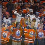 
              Edmonton Oilers fans cheer a goal against the Los Angeles Kings during the second period in Game 7 of a first-round series in the NHL hockey Stanley Cup playoffs Saturday, May 14, 2022, in Edmonton, Alberta. (Jeff McIntosh/The Canadian Press via AP)
            