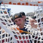 
              Maryland players cut the goal netting after defeating Cornell in the NCAA college men's lacrosse championship game, Monday, May 30, 2022, in East Hartford, Conn. Maryland completed a perfect season by holding off Cornell 9-7. (AP Photo/Bryan Woolston)
            