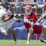 
              Maryland midfielder Bubba Fairman (2), left, plays against Cornell attack CJ Kirst (15) during the first half of the NCAA college men's lacrosse championship game, Monday, May 30, 2022, in East Hartford, Conn. (AP Photo/Bryan Woolston)
            