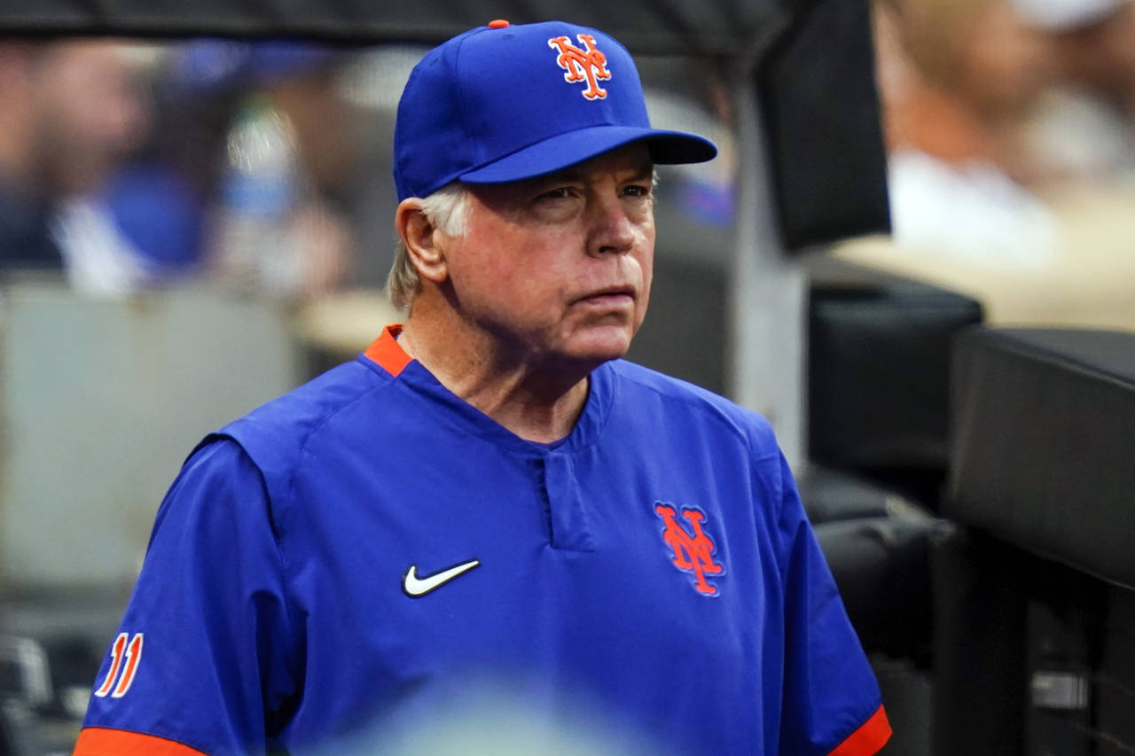 New York Mets manager Buck Showalter watches his team play during the eighth inning in the first ba...