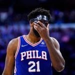 
              Philadelphia 76ers' Joel Embiid adjusts his mask during the second half of Game 6 of an NBA basketball second-round playoff series against the Miami Heat, Thursday, May 12, 2022, in Philadelphia. (AP Photo/Matt Slocum)
            
