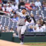 
              Los Angeles Dodgers third baseman Justin Turner throws to first to put out Washington Nationals' Josh Bell during the second inning of a baseball game, Wednesday, May 25, 2022, in Washington. (AP Photo/Nick Wass)
            